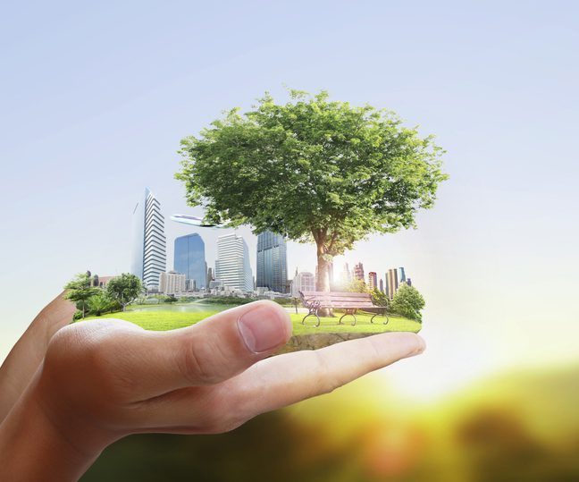 Human holding a city in their hands